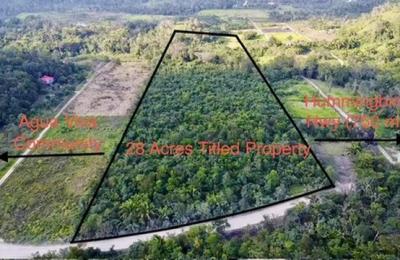 28 acres at the entrance to Agua Viva, minute from Hummingbird highway, With creek and cave